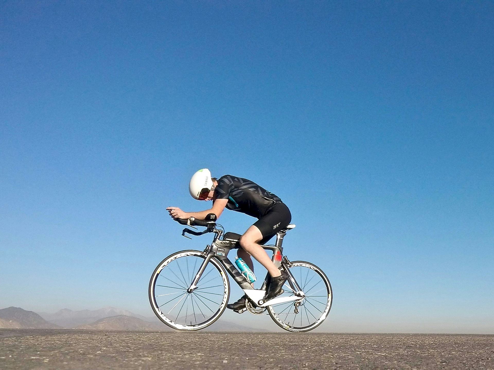 cyclist blue sky